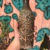 green carved vase