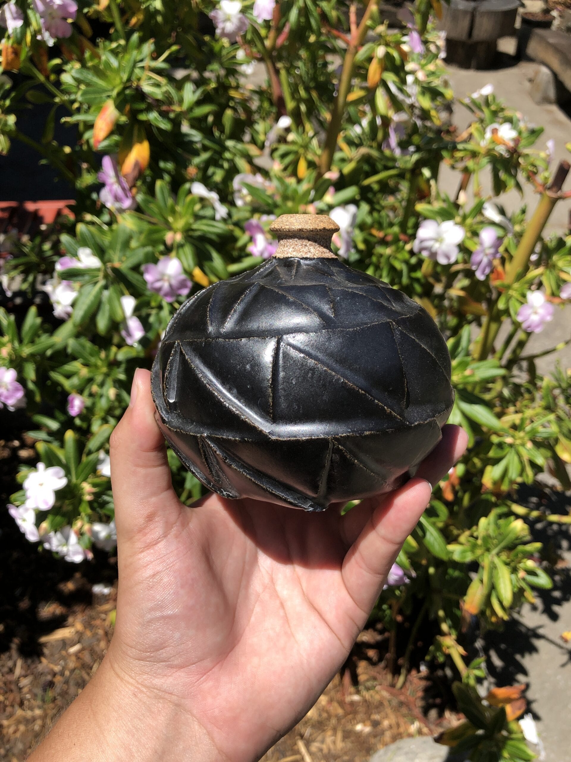 black carved bud vase