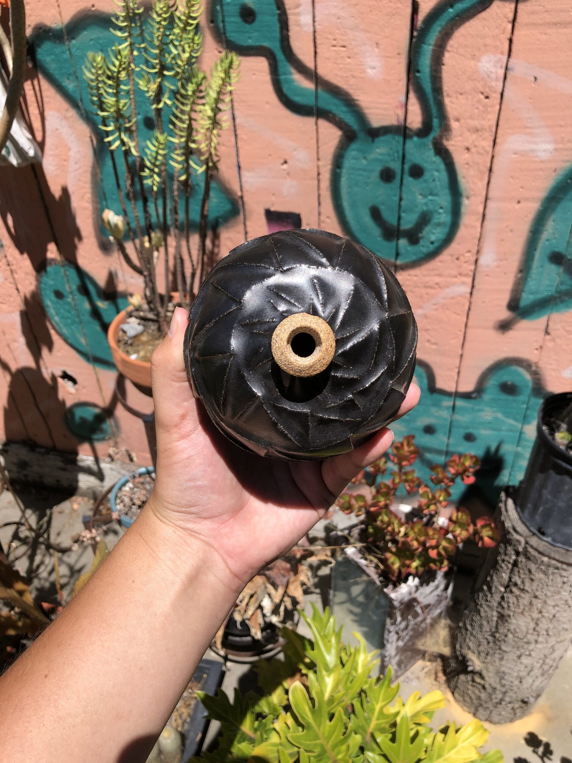 black carved bud vase