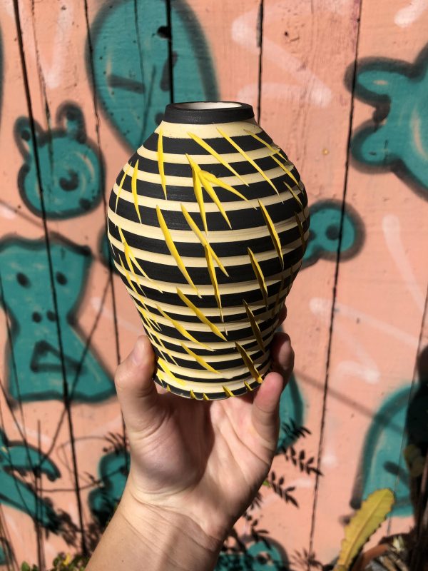 black yellow vase