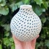dark blue triangle bud vase