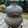 dark floating blue carved bud vase