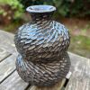 dark floating blue carved bud vase