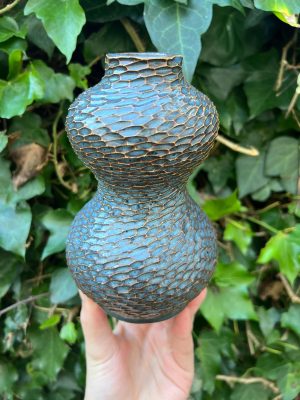 floating blue carved bud vase