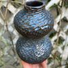 floating blue carved bud vase