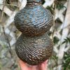 floating blue carved bud vase