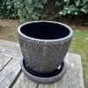 black carved planter