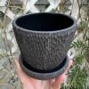 black carved planter